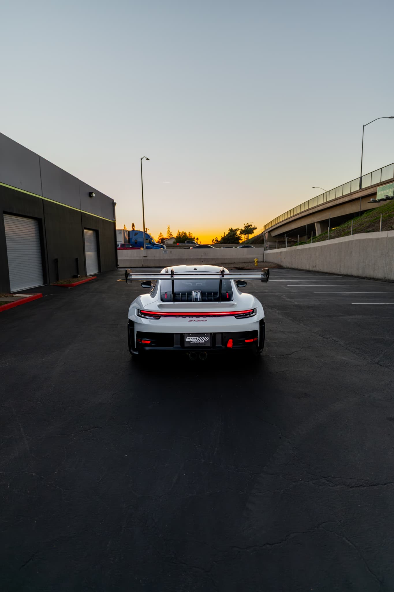 Porsche GT3 RS parked at 961 Motorsport at sunset